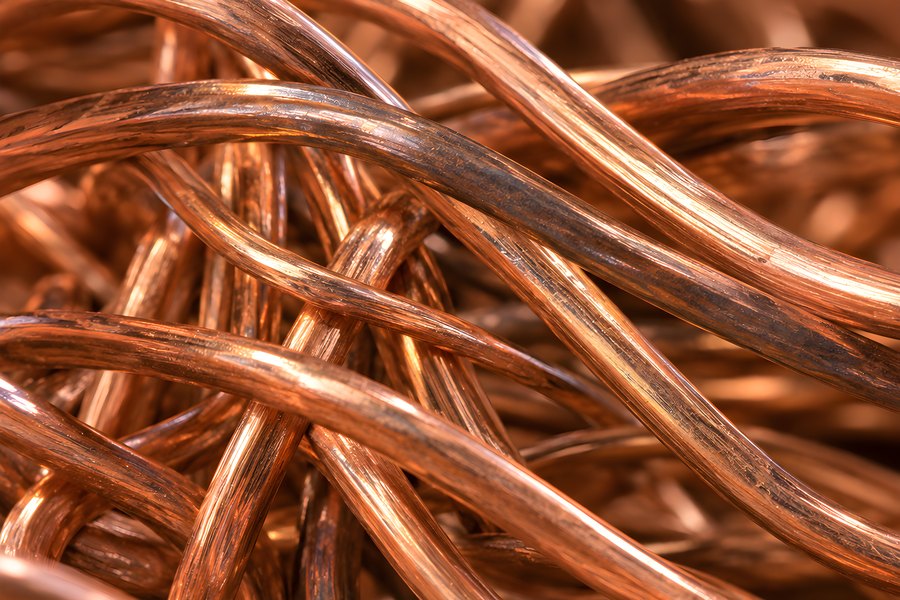 Tangled pile of bare copper wire scrap for metal recycling and secondary raw material sourcing